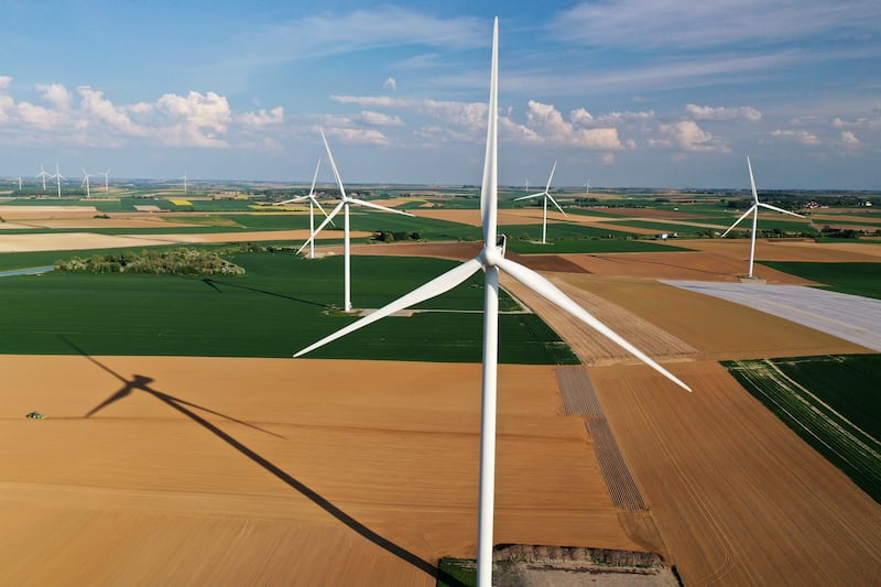An aerial view shows power-generating windmill turbines in a wind farm in Graincourt-les-Havrincourt, France. Reuters
