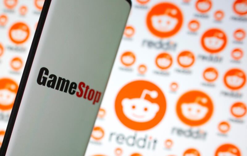 GameStop logo is seen in front of displayed Reddit logo in this illustration taken February 2, 2021. REUTERS/Dado Ruvic/Illustration