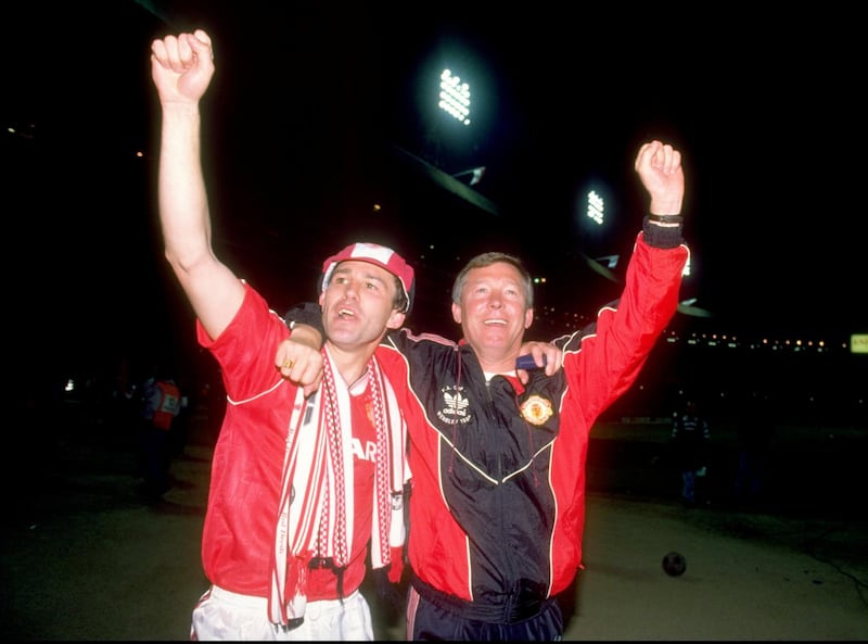 20 May 1990:  Bryan Robson of Manchester United and Manager Alex Ferguson celebrate after their victory in the FA Cup Final against Crystal Palace at Wembley Stadium in London, England.  Manchester United won the match 1-0 after extra time. \ Mandatory Credit: Allsport UK /Allsport