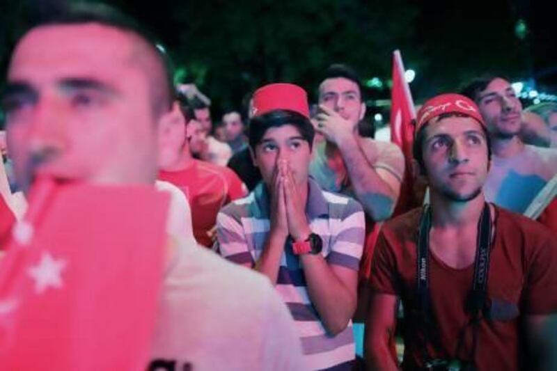Turks in Istanbul show their dejection after it was announced that Tokyo was elected to host the 2020 Olympics.