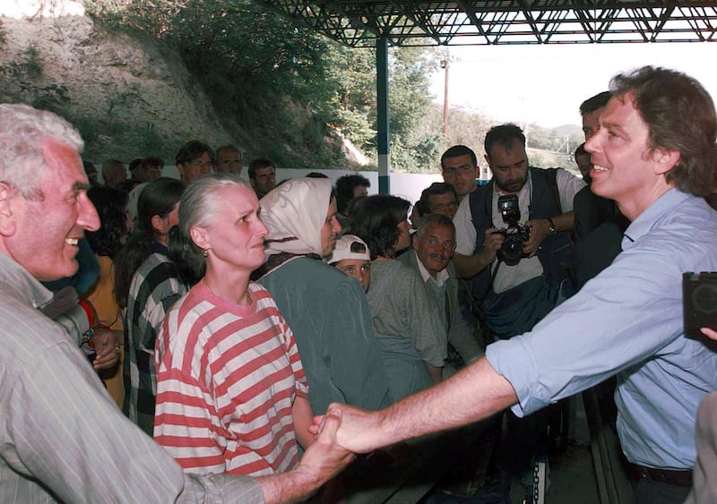 Former UK prime minister Tony Blair meets Kosovan refugees at the border crossing point between Kosovo and Macedonia, near Skopje. PA