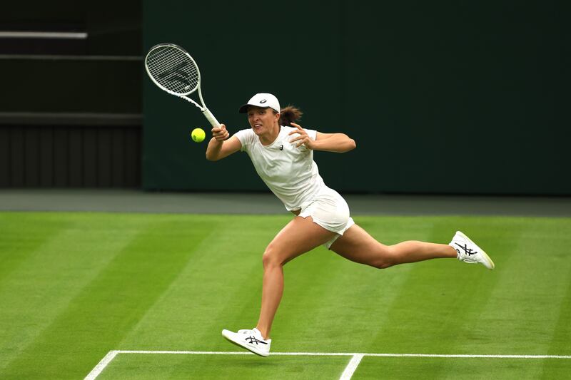 Iga Swiatek plays a forehand during training. Getty