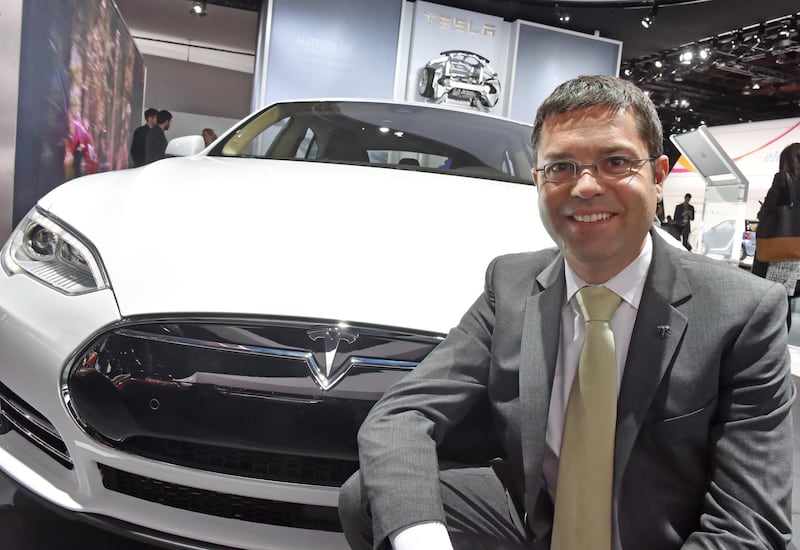 Jerome Guillen, vice president and head of sales and service for Tesla, in front of a Tesla Model S at the North American International Auto Show (NAIAS) 2015 at the Cobo Arena in Detroit, Michigan, USA, 13 January 2015. The public show runs from 17 to 25 January 2015. Photo:Â ULIÂ DECK/dpa | usage worldwide   (Photo by Uli Deck/picture alliance via Getty Images)