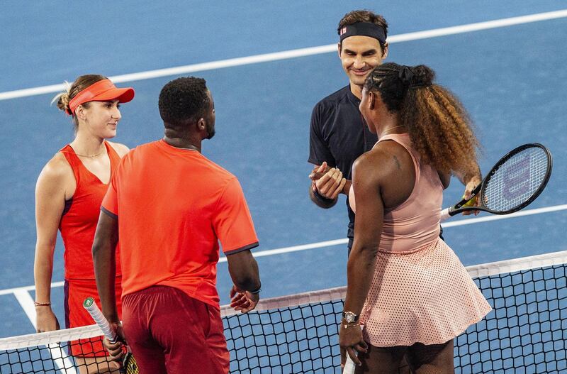 Roger Federer and Belinda Bencic of Switzerland celebrate their win over Frances Tiafoe and Serena Williams of the US. EPA