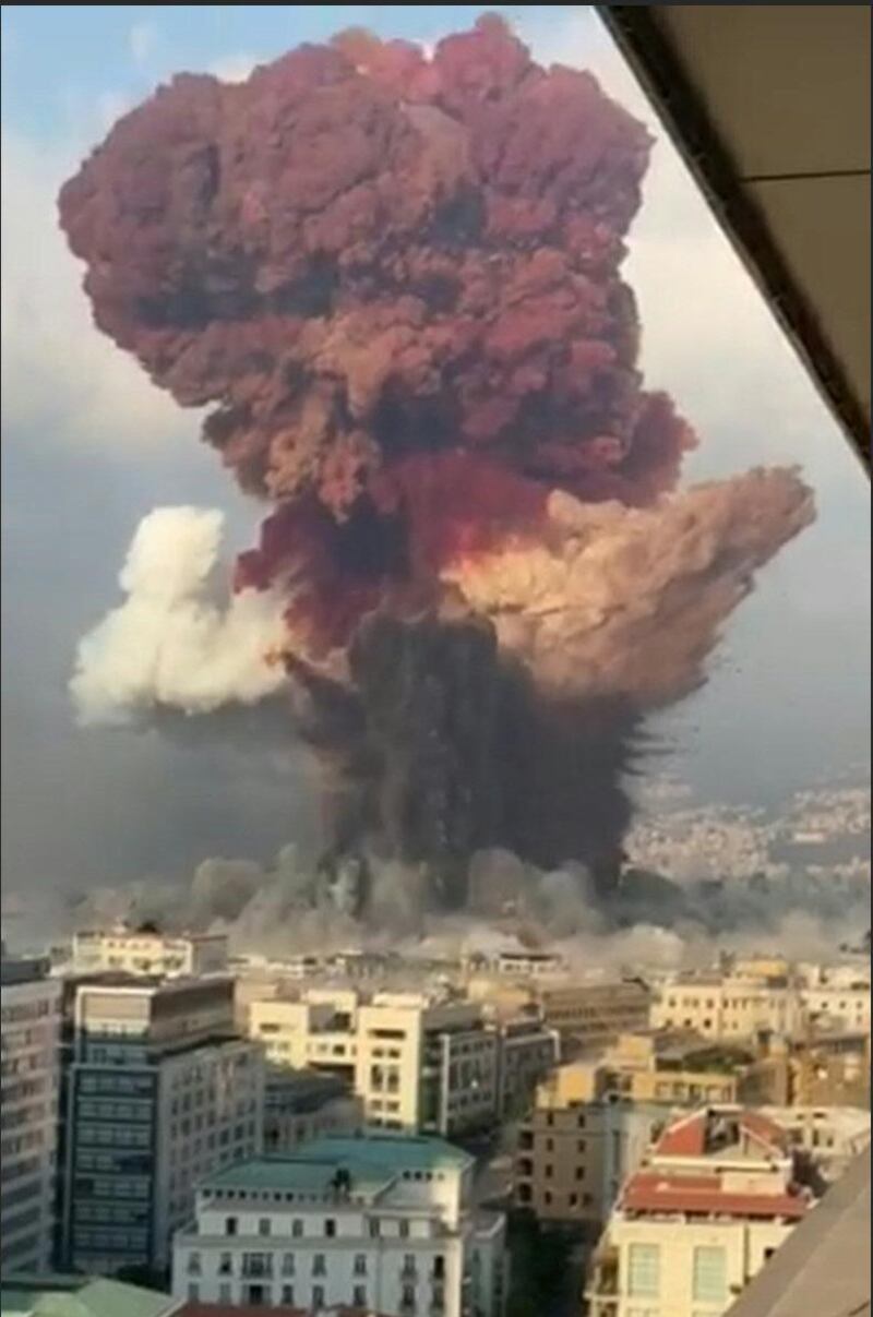 A screenshot from a UGC footage filmed from an office building at the moment a massive explosion rocked Beirut shows a fireball exploding while smoke is billowing at the port of the Lebanese capital on August 4, 2020. AFP