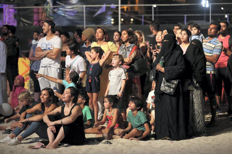 Dubai, United Arab Emirates - April 06, 2019: The crowd watches the big screen during the mens final of the Gov Games 2019. Saturday the 6th of April 2019. Kite Beach, Dubai. Chris Whiteoak / The National