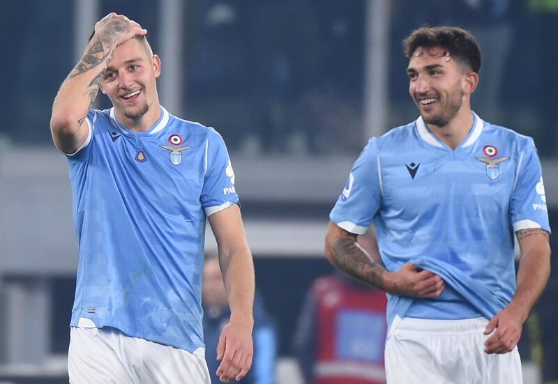 Lazio's Serbian midfielder Sergej Milinkovic-Savic (L) and Lazio's Italian midfielder Danilo Cataldi celebrate. AFP