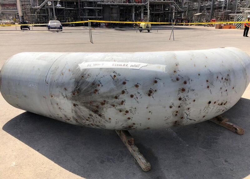 A damaged section of pipe lies near the Khurais oil field in Saudi Arabia. The attacks caused the most significant disruption to supply in history. Bloomberg