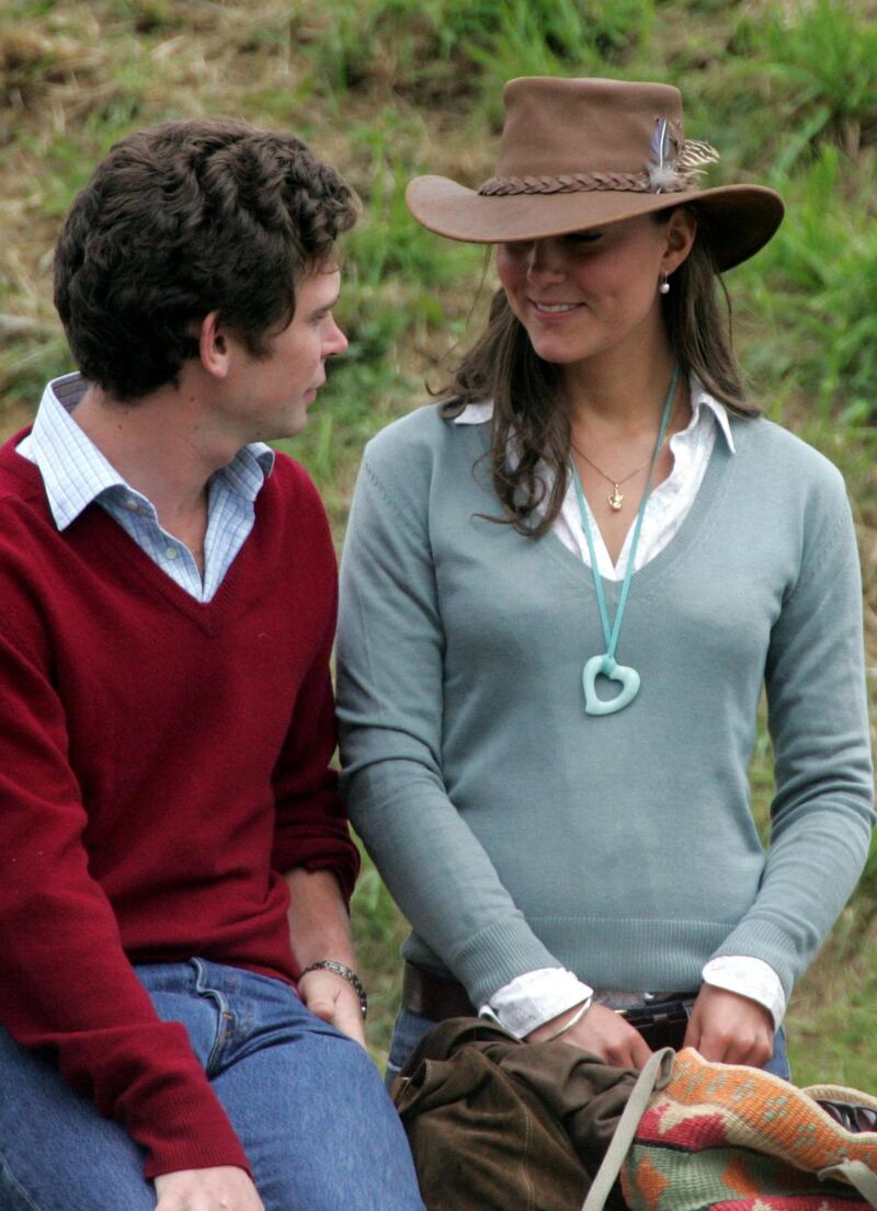 TETBURY, ENGLAND - AUGUST 6: Kate Middleton, girlfriend of Prince William chats with friends and companions in front of the main arena, on the second day of the Gatcombe Park Festival of British Eventing at Gatcombe Park, on August 6, 2005 near Tetbury, England. (Photo by Matt Cardy/Getty Images) 