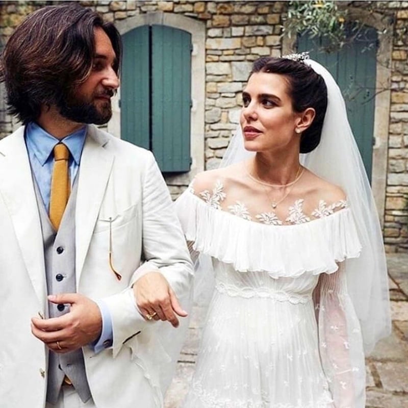 Charlotte Casiraghi, daughter of Monaco's Princess Caroline, wed Lebanese-French film producer Dimitri Rassam at the Abbaye Sainte-Marie de Pierredon, in Saint-Remy-de-Provence, France, on June 29, 2019. The bride wore a Giambattista Valli gown with a sheer neckline and romantic ruffled tiers. Instagram / Giambattista Valli