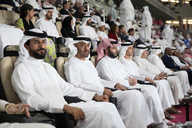 AL AIN, UNITED ARAB EMIRATES - April 18, 2019: HH Sheikh Mohamed bin Zayed Al Nahyan Crown Prince of Abu Dhabi Deputy Supreme Commander of the UAE Armed Forces (2nd L) attends the 2018–19 Zayed Champions Cup final football match between Al Hilal and Etoile du Sahel, at Hazza bin Zayed Stadium. Seen with HH Sheikh Nasser bin Hamad bin Isa Al Khalifa, Representative of His Majesty the King for Charity Works and Youth Affairs and Chairman of the Board of Trustees of the Royal Charity Organisation of Bahrain (L), HE Turki bin Abdul Mohsen Al Sheikh, Chairman of the General Entertainment Authority of Saudi Arabia (3rd L) and HH Sheikh Hazza bin Zayed Al Nahyan, Vice Chairman of the Abu Dhabi Executive Council (4th L).

( Mohammed Al Bloushi for Ministry of Presidential Affairs )
---