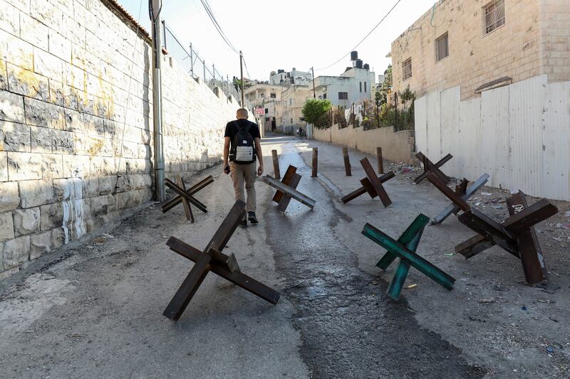 Barricades block a main street at the Jenin refugee camp in the occupied West Bank. EPA