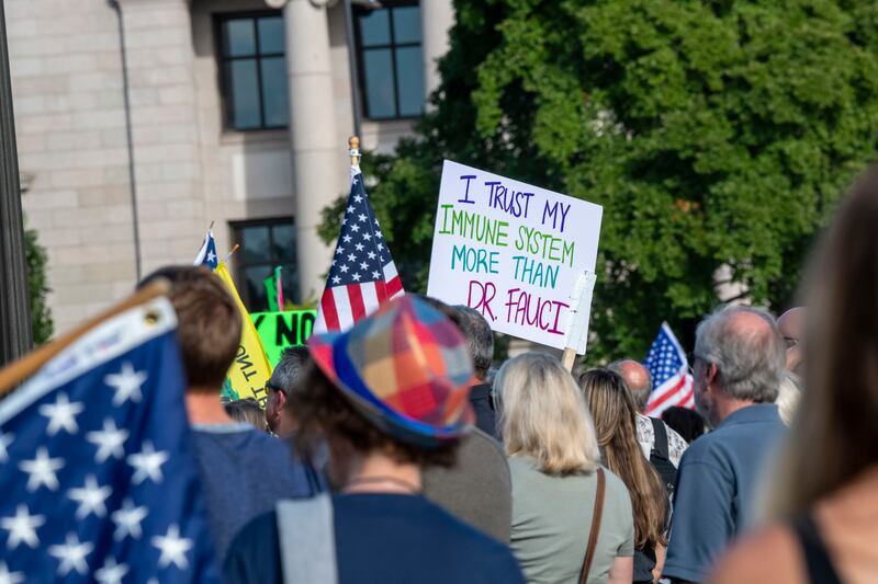 A placard with a slogan directed toward Anthony Fauci is displayed during an anti-vaccine protest in Minnesota. Getty Images