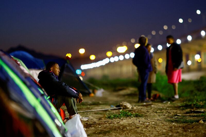 Angel Avila, a migrant from Venezuela who has not crossed into the US because of new immigration policies, camps out on the banks of the Rio Bravo river, in Ciudad Juarez, Mexico. Reuters