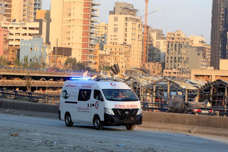 An ambulance drives near the site of Tuesday's blast in Beirut's port area. Reuters