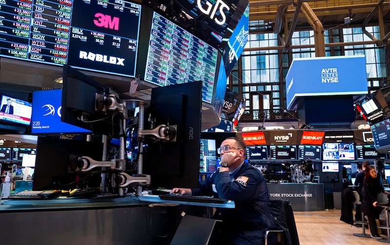Traders work on the floor of the New York Stock Exchange. The S&P 500 sank 1.5 per cent on Friday, with banks and chip makers leading losses. AP