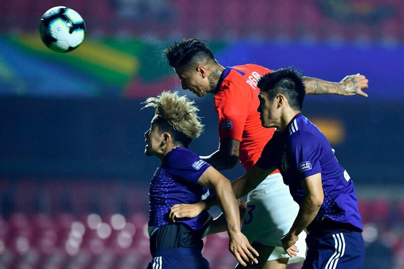 Chile's Erick Pulgar heads in the opening goal against Japan. Chile won the Group C 2019 Copa America match at Morumbi Stadium in Sao Paulo 4-0. AFP