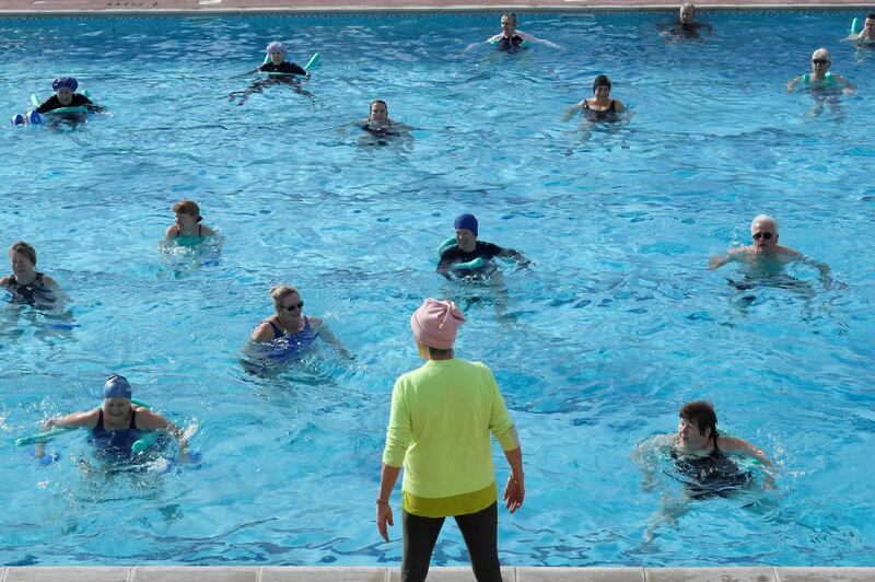 Swimmers take part in an aqua aerobics class in Hampton Lido in London. Reuters