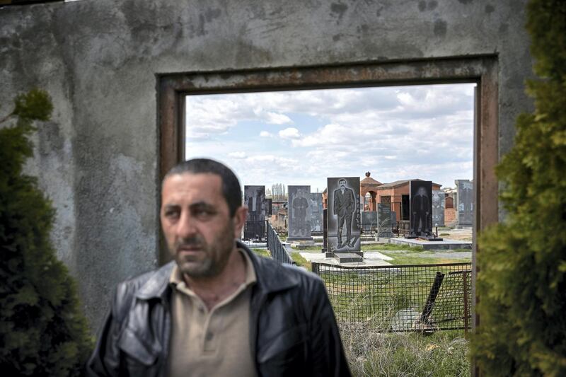 AKNALICH, ARMENIA - APRIL 14: A Yazidi leaves the graveyard at the Quba Mere Diwane Temple, the worldÕs largest Yazidi Temple, on Yazidi New Year on April 14, 2021 in Aknalich, Armenia. According to the 2011 census, there are 35,272 Yazidis in Armenia, making them Armenia's largest ethnic minority group. Photo by Kiran Ridley