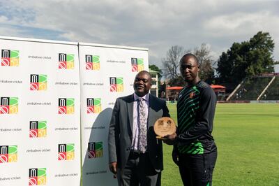 Tendai Chatara, who took three wickets for Zimbabwe in the first ODI against the UAE, receives his man-of-the-match award from Zimbabwe Cricket board member Ronald Chibwe (Pic - Zimbabwe Cricket)