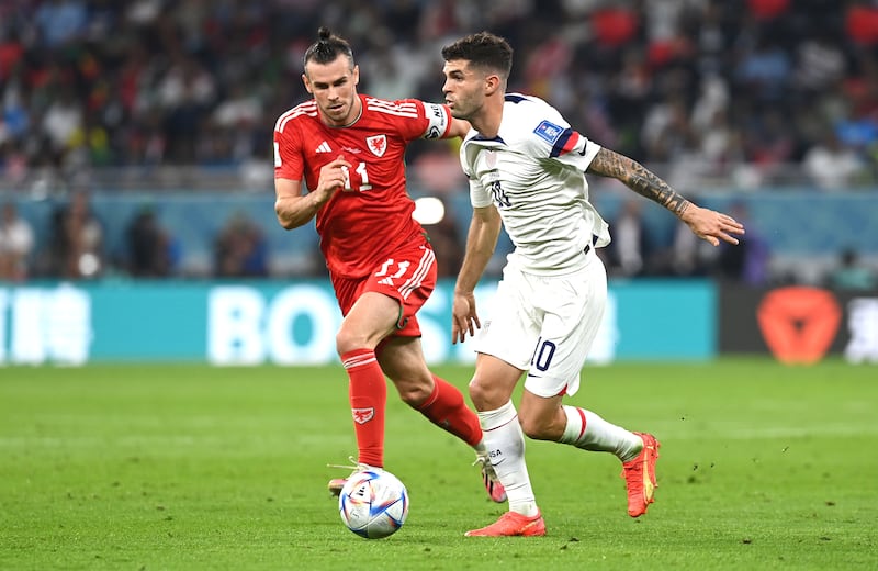 Christian Pulisic of the USA in action against Gareth Bale. EPA