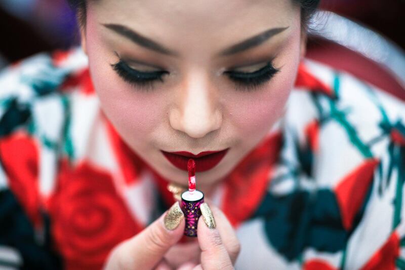 A participant prepares backstage before the final show of the Miss Jumbo 2018 at a department store in Nakhon Ratchasima, Thailand. Athit Perawongmetha / Reuters