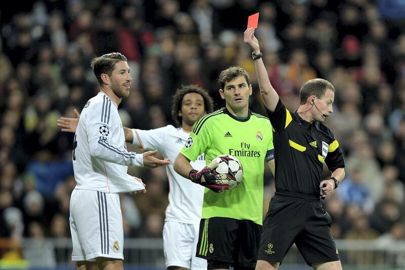 MADRID, SPAIN - NOVEMBER 27:  Referee William Collum shows the red card to Sergio Ramos of Real Madrid CF during the UEFA Champions League group B match between Real Madrid CF and Galatasaray AS at Estadio Santiago Bernabeu on November 27, 2013 in Madrid, Spain.  (Photo by Gonzalo Arroyo Moreno/Getty Images)