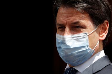 Italian Prime Minister Giuseppe Conte wearing a protective face mask, leaves the Senate as the spread of the coronavirus disease (COVID-19) continues Reuters