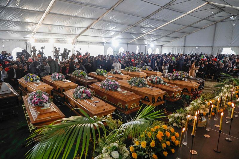 Empty coffins used in a symbolic mass memorial service in East London, South Africa, after 21 people, mostly teenagers, died in a nightclub last month. AFP