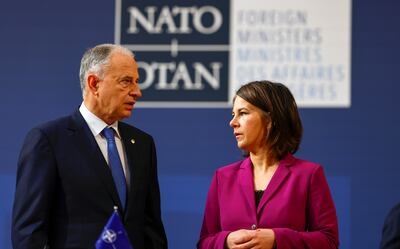Nato Deputy Secretary General Mircea Geoana talks to Annalena Baerbock, Foreign Minister of Germany, before a Nato meeting in Berlin on Sunday. EPA
