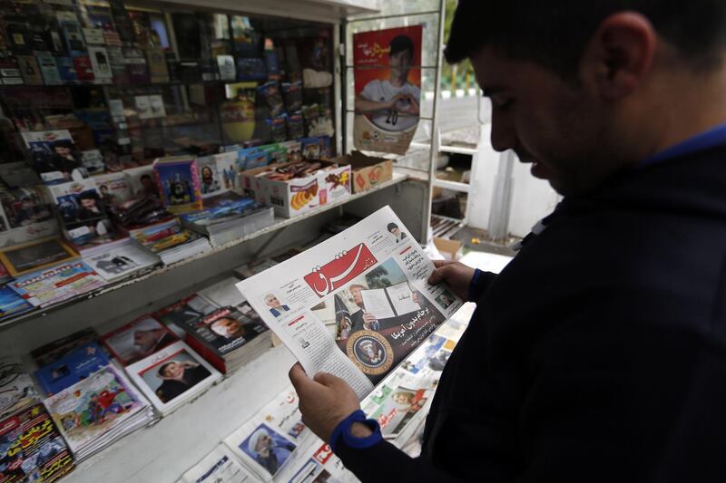 epa06721324 An Iranian man reads a copy of Iranian daily newspaper 'Shargh' with a picture of US President Donald J. Trump on its front page with the title reading 'Nuclear deal without US' in Tehran, Iran, 09 May 2018. According to reports, Iran said it will negotiate the nuclear agreement with five remaining countries. US president Donald Trump on 08 May announced that US will withdraw from the nuclear deal. Foreign ministers from six world powers and Iran achieved an agreement to prevent the Islamic republic from developing nuclear weapons, Western diplomats said in Vienna on 14 July 2015.  EPA/STRINGER