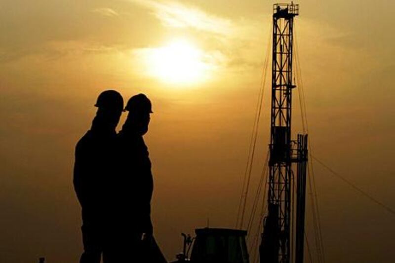 Oil workers at the desert oil fields of Sakhir, Bahrain. Salaries in the Gulf region are outstripping global rates. AP Photo / Hasan Jamali