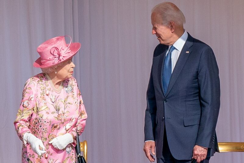 Mr Biden and Queen Elizabeth. Reuters