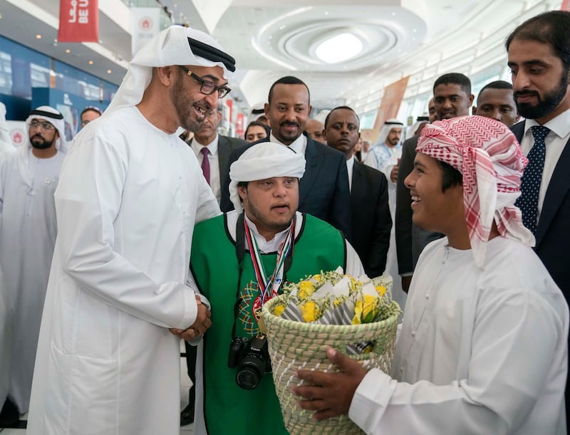 ABU DHABI, UNITED ARAB EMIRATES - March 18, 2019: HH Sheikh Mohamed bin Zayed Al Nahyan, Crown Prince of Abu Dhabi and Deputy Supreme Commander of the UAE Armed Forces (L) and HE Abiy Ahmed, Prime Minister of Ethiopia (back C), tour the Special Olympics World Games Abu Dhabi 2019, at Abu Dhabi National Exhibition Centre (ADNEC).

( Ryan Carter / Ministry of Presidential Affairs )?
---