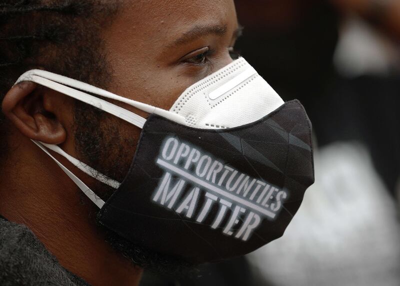 A man wears a face mask that reads "Opportunities Matter" during a Juneteenth celebration in Tulsa, Oklahoma. AFP