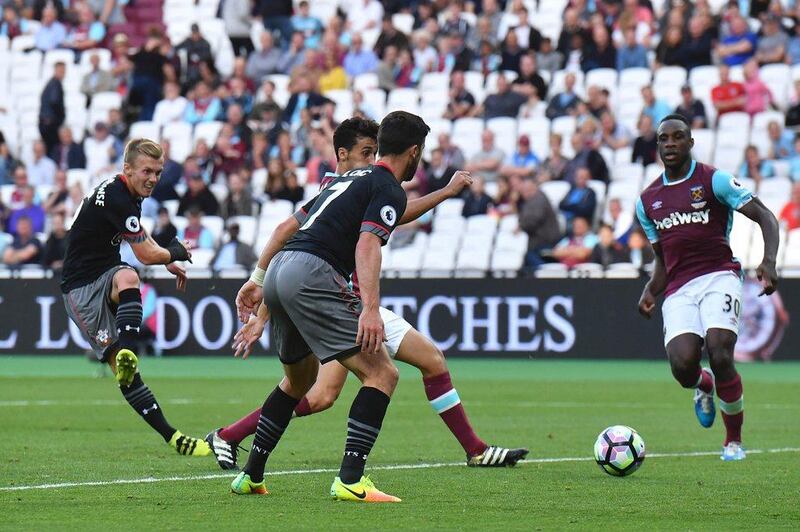 Southampton’s James Ward-Prowse, left, scores their third goal. Ben Stansall / AFP
