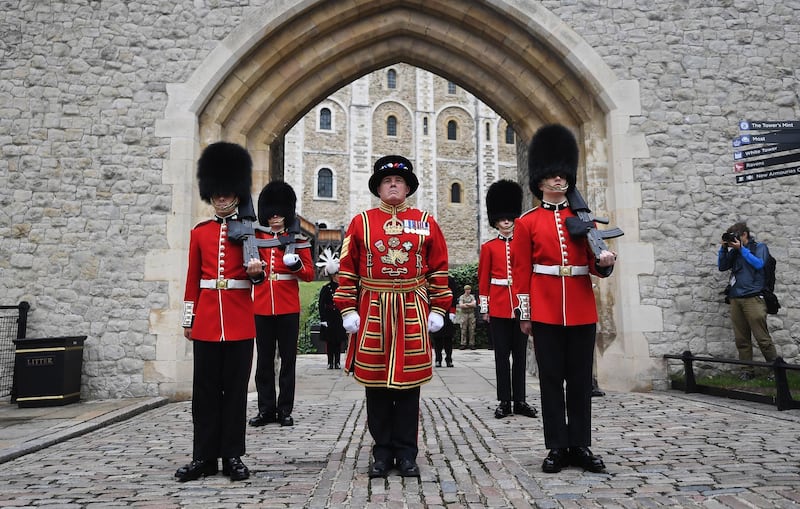Beefeaters and a guardsman officially reopen the Tower of London. EPA