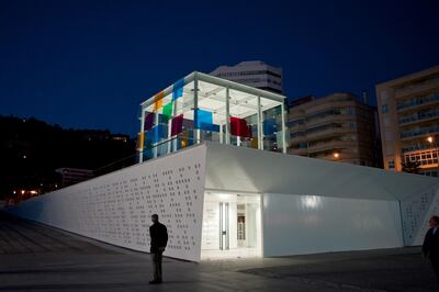 A man watches the Pompidou Art Centre of Malaga after a visit for the press, in Malaga on March 27, 2015. The M��laga centre will hold some 80 paintings and photographs including Pablo Ruiz Picasso, Rineke Dijkstra, Tony Oursler, Frida Kahlo, Francis Bacon, Max Ernst, Ren�� Magritte, Chirico, Alberto Giacometti and Sophie Calle, among others. The Museum opens its doors on March 28, 2015.   AFP PHOTO/ JORGE GUERRERO / AFP PHOTO / Jorge Guerrero