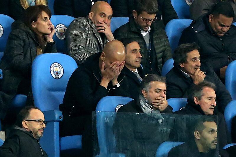 A dejected Pep Guardiola is seen in the stands after he had been sent off the pitch. Nigel Roddis / EPA