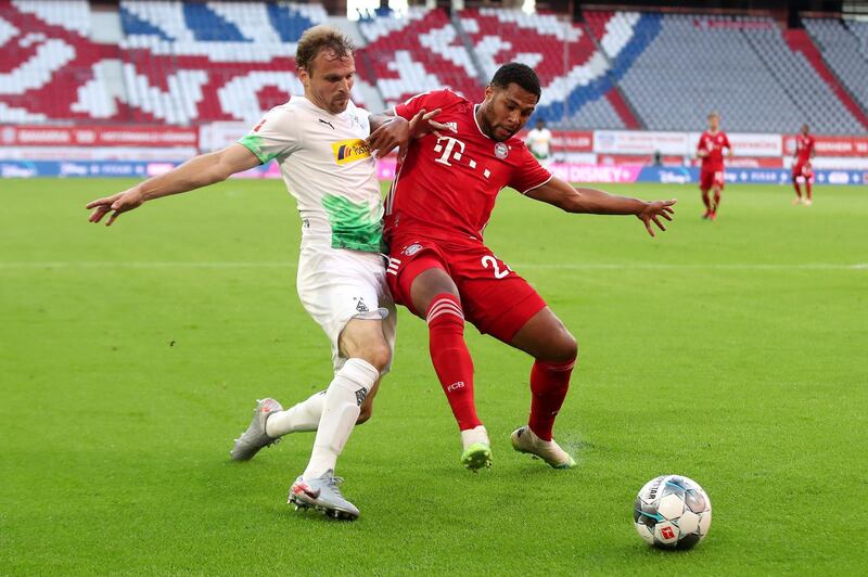 Serge Gnabry of Bayern Munich is challenged by Tony Jantschke of Borussia Monchengladbach. EPA