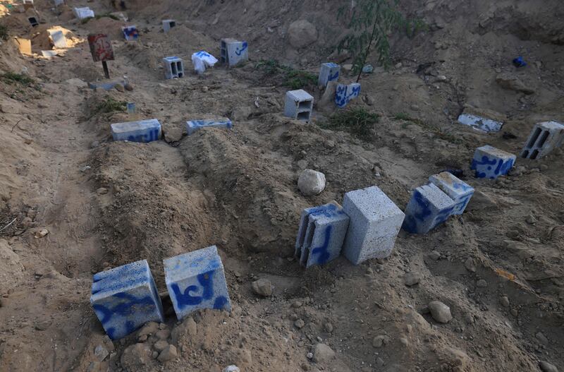 Breeze blocks are used as tombstones at the Deir Al Balah cemetery in the central Gaza Strip. AFP