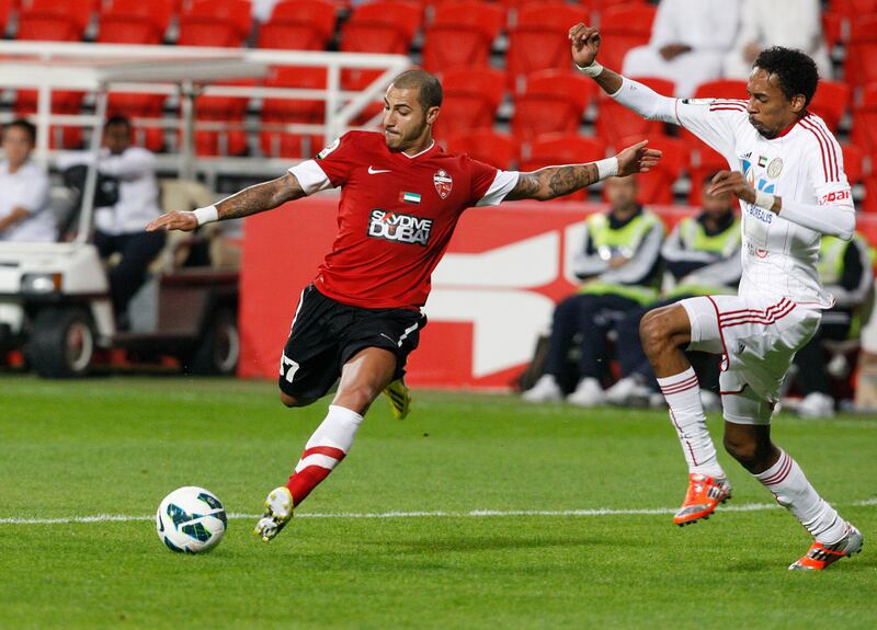 Abu Dhabi, United Arab Emirates , Jan 26 2013, Al Jazira v Al Ahli- (left) Al Ahli's #37Ricardo Quaresma works the ball free and shoots on goal . Mike Young / The NationaL