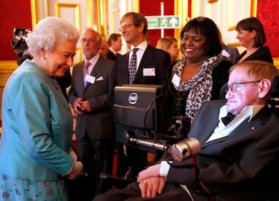 FILE - In this May 29, 2014 file photo, Britain's Queen Elizabeth II meets Professor Stephen Hawking, during a reception for Leonard Cheshire Disability in the State Rooms, St James's Palace, London. Hawking, whose brilliant mind ranged across time and space though his body was paralyzed by disease, has died, a family spokesman said early Wednesday, March 14, 2018. (Jonathan Brady/PA via AP)