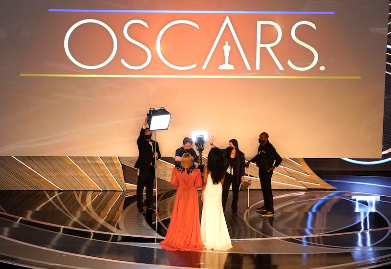 Serena and sister Venus Williams introduce a performance by Beyonce at the Oscars.  AP