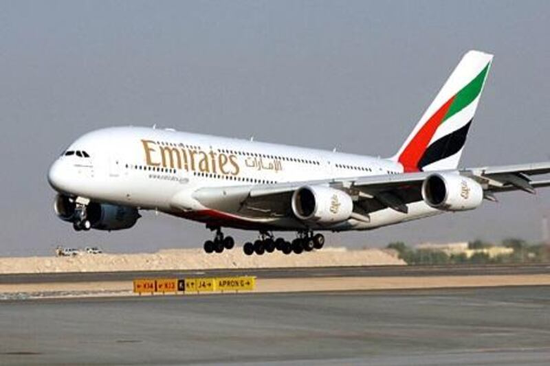 File - In this Nov. 21, 2005 file photo, an Airbus A380 of Emirates Airlines take off for a demonstration flight during the Air show, in Dubai, United Arab Emirates. Emirates airline, the biggest buyer of the "superjumbo" Airbus A380, said Wednesday, Nov. 11, 2009, it is considering increasing its order for the double-decker plane despite delays on existing orders. (AP Photo/Aziz Shah, file) *** Local Caption ***  NYBZ118_Dubai_Airbus.jpg