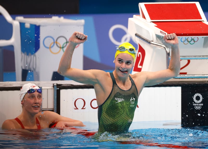 Kaylee McKeown of Australia (R) celebrates after winning the women's 200m backstroke.