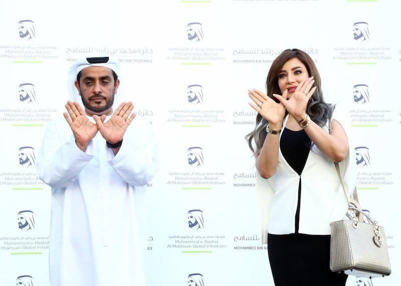 Ahmed Al Mansouri, secretary general of the Mohammed bin Rashid Award for Tolerance, and Lojain Omran at the Armani Hotel, in the Burj Khalifa, where they launched the “Tolerance Sign”. 