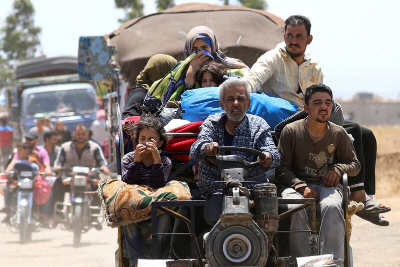 FILE PHOTO: Internally displaced people from Deraa province arrive near the Israeli-occupied Golan Heights in Quneitra, Syria June 29, 2018. REUTERS/Alaa Al-Faqir/File Photo