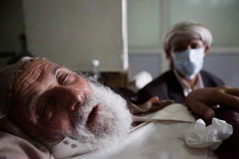 An old man infected with cholera lies on a bed at a hospital in Sanaa on May 12, 2017. Mohamed Al Sayaghi / Reuters
