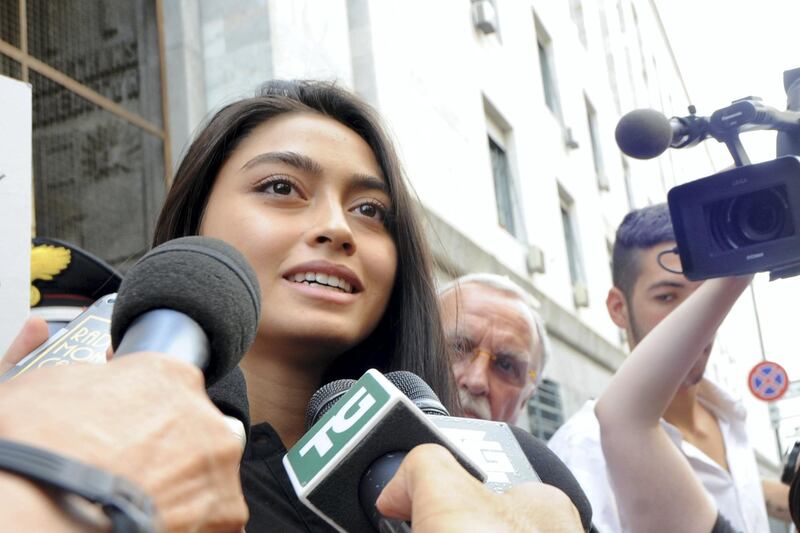 MILAN, ITALY - JULY 19:  Ambra Battilana speaks to waiting media outside the courthouse after the verdicts in the 'Ruby bis' case on July 19, 2013 in Milan, Italy. Nicole Minetti, Emilio Fede and Lele Mora were found guilty of aiding and abetting in the procurement of prostititutes for 'bunga bunga' parties held by former Italian prime minister Silvio Berlusconi. (Photo by Pier Marco Tacca/Getty Images)